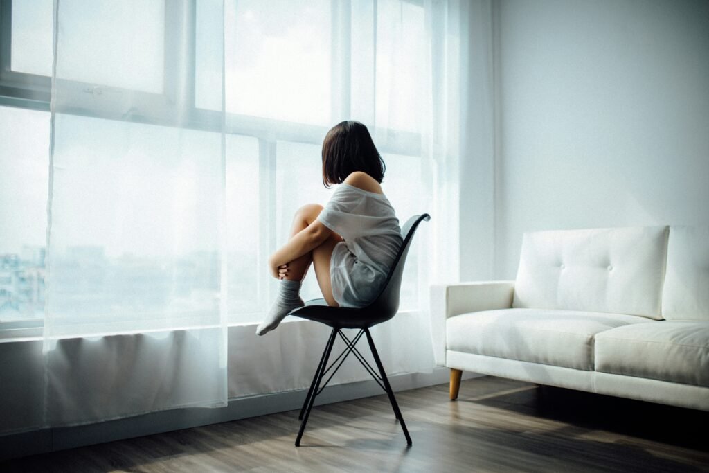 Lady in a chair looking despaired 