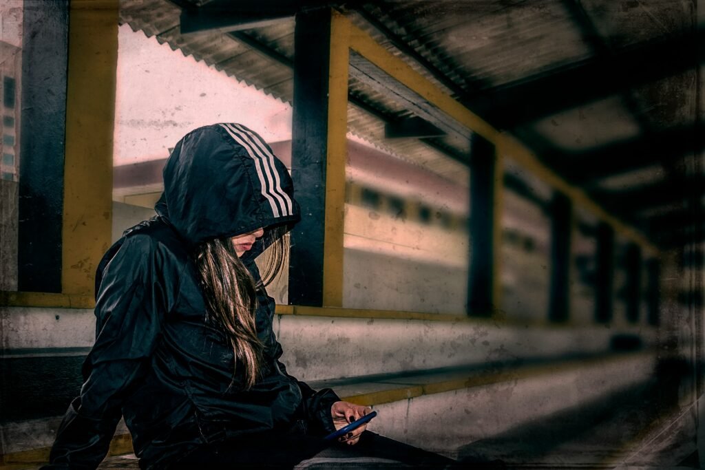 Lady sitting under the rails