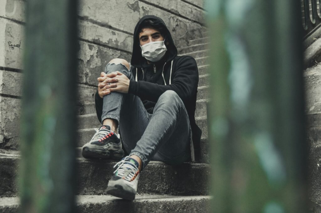 Man sitting in a stairwell