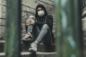 Man sitting in a stairwell